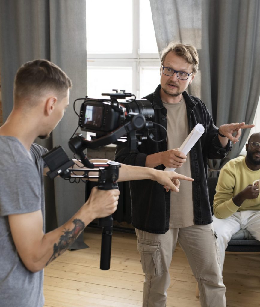Online-Recruiting 4 a group of men standing in a room with a camera